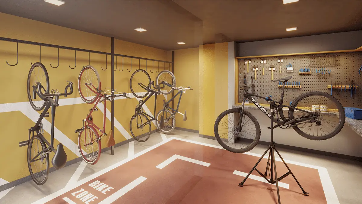 Bicicletário com suportes e bancada de manutenção.